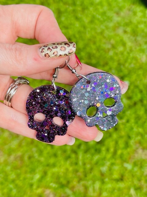 Sparkly resin skull earrings