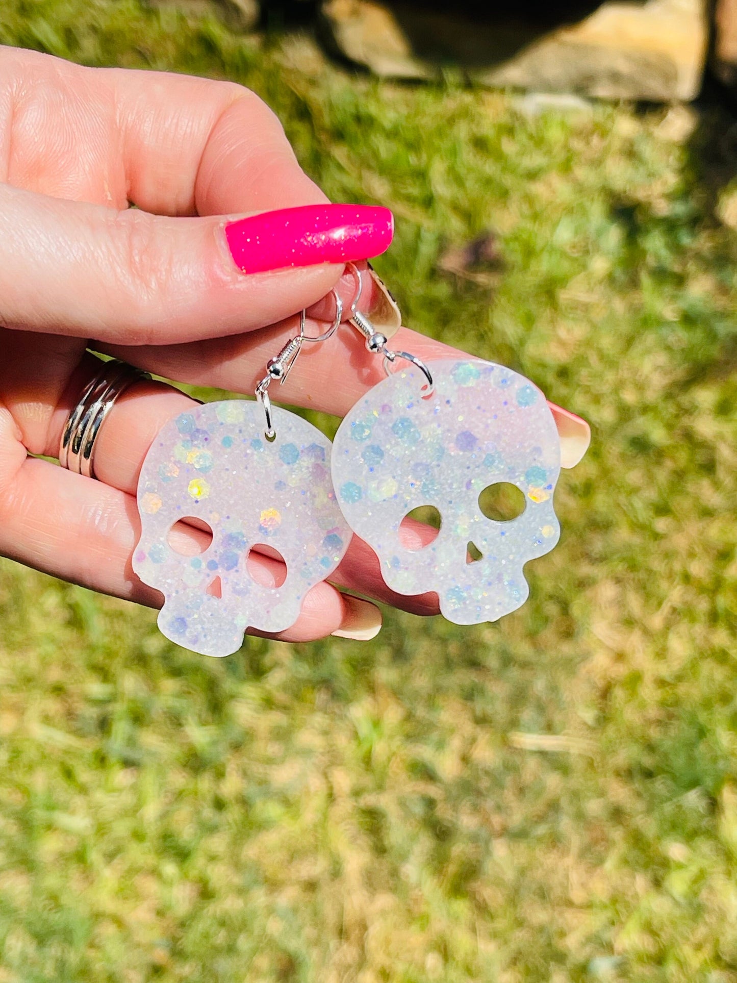 Sparkly resin skull earrings