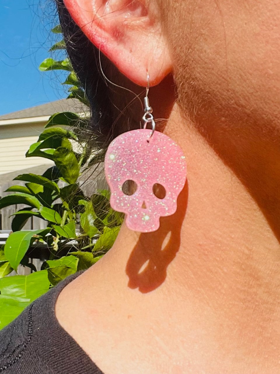Sparkly resin skull earrings