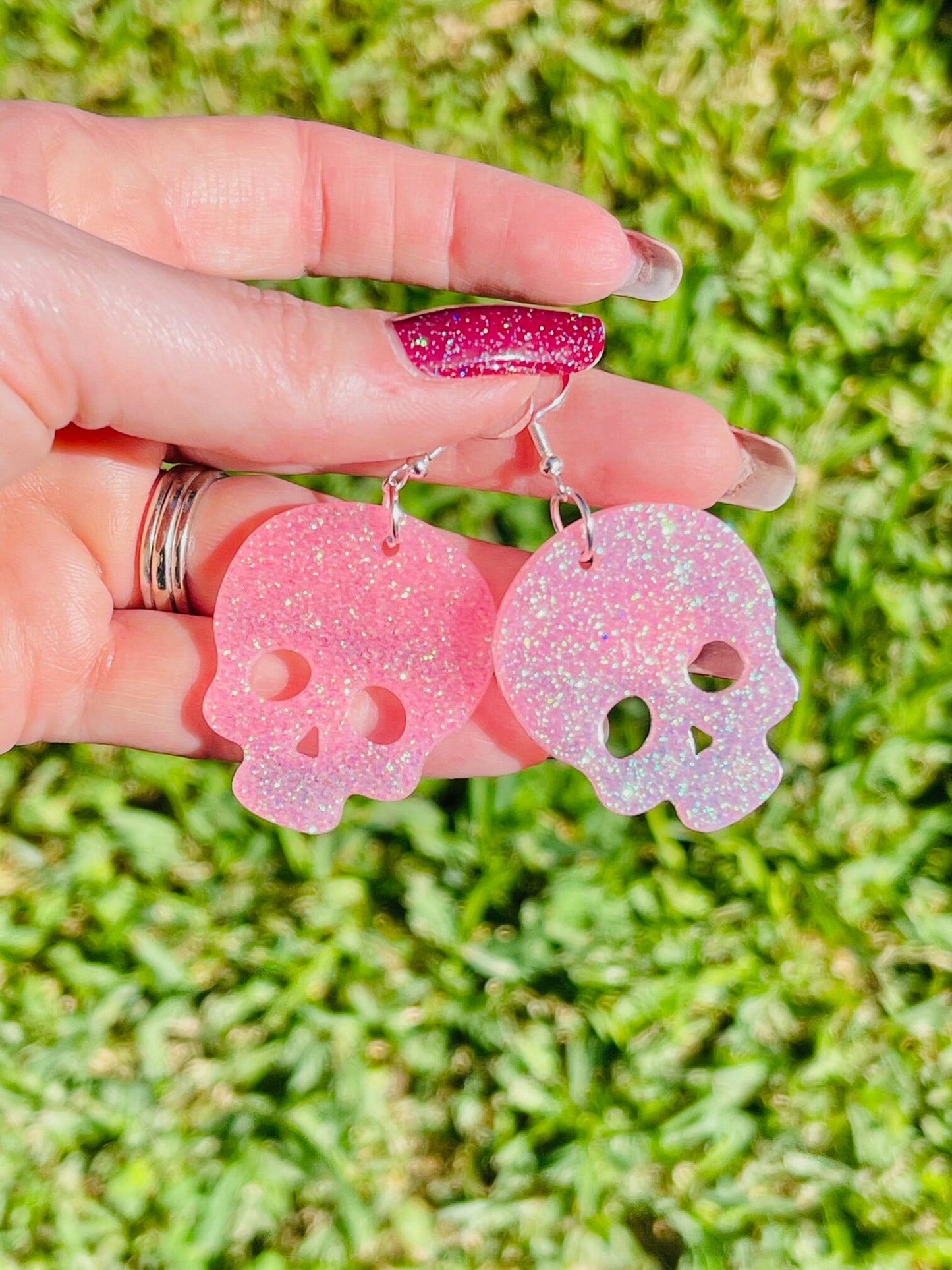 Sparkly resin skull earrings