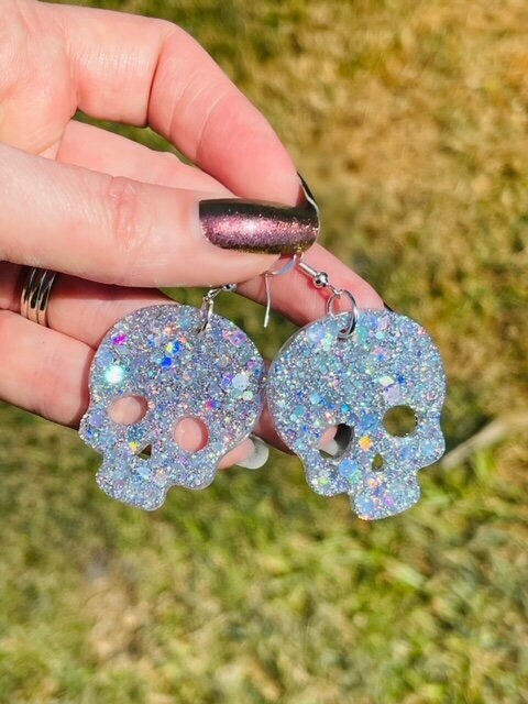 Sparkly resin skull earrings